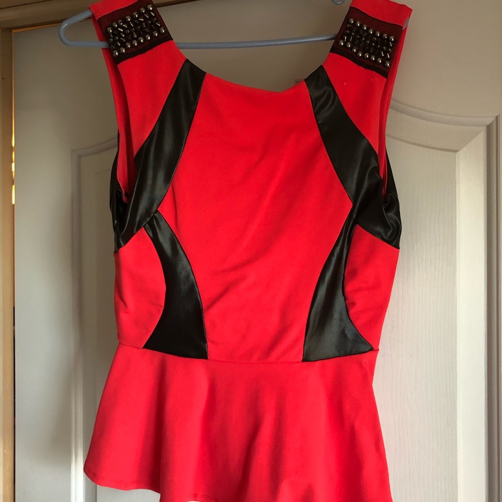 Bebe red and black peplum top/studded shoulders